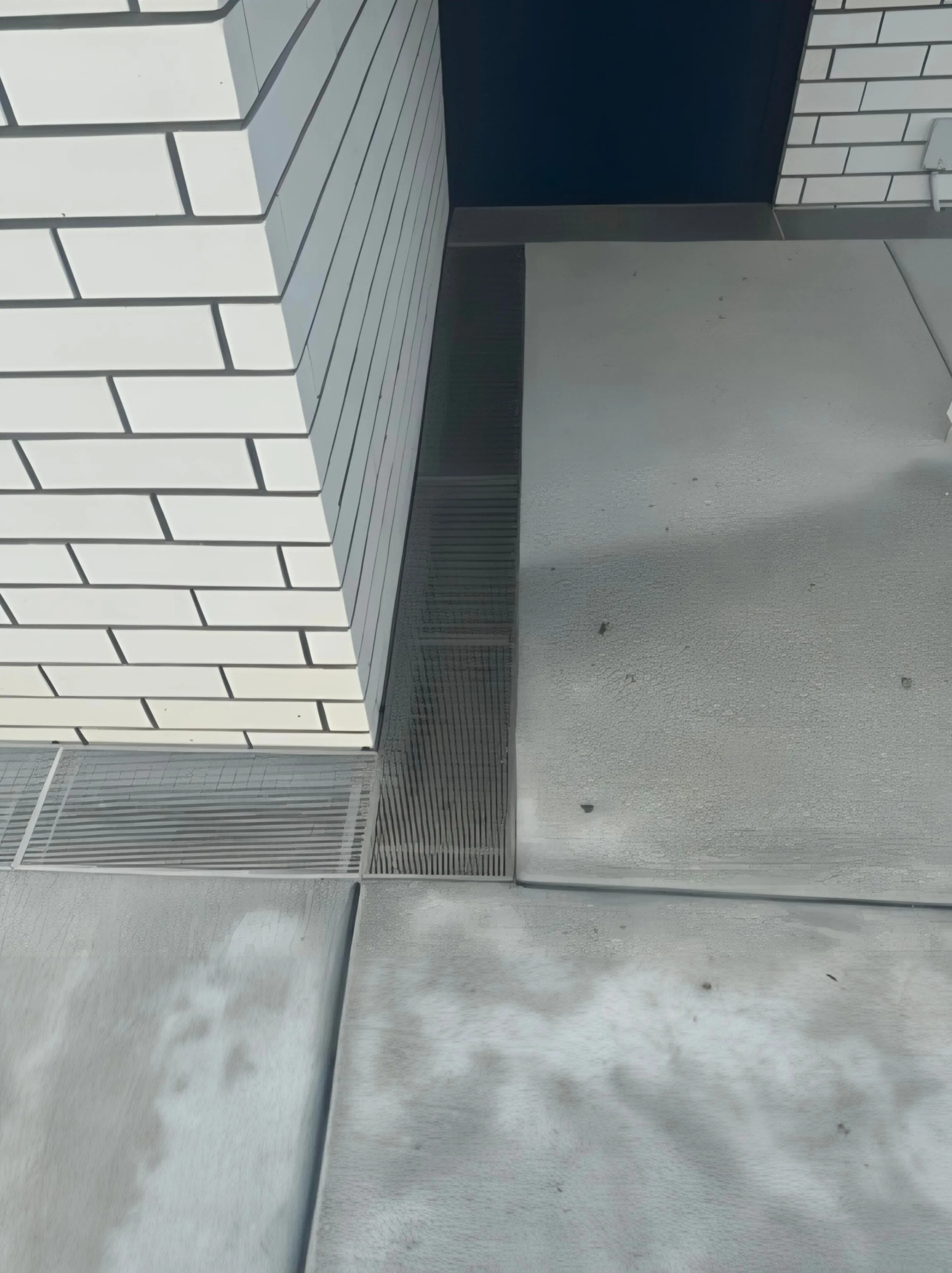 Channel drain installed in a concrete driveway in Christchurch