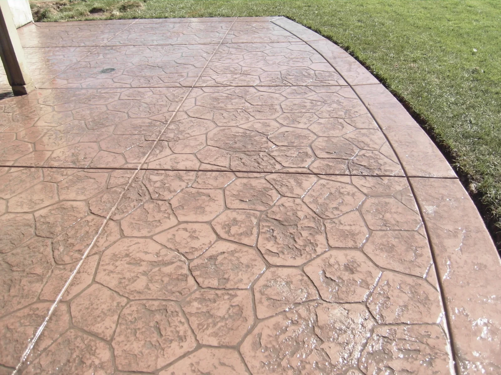 Stamped patterned concrete surface resembling natural stone